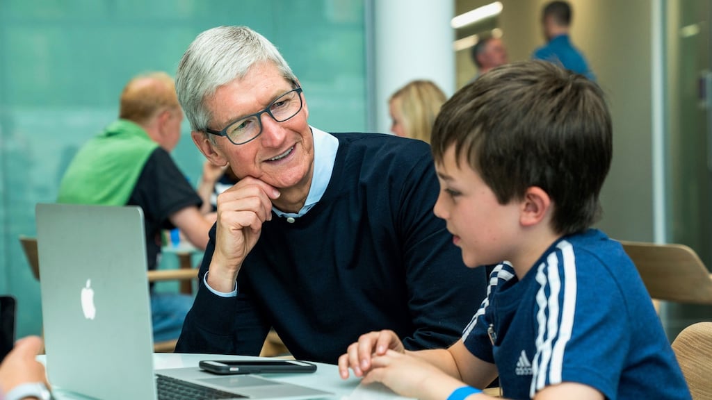 Apple CEO Tim Cook with 14-year-old app developer Niall Kehoe at Apple in Cork