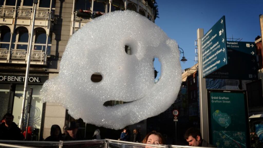 Foam happy face clouds take to the sky on St Stephen’s Green for the launch of First Fortnight 2014, which runs today to January 16th. Photograph: David Sleator