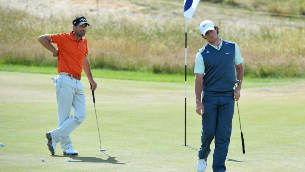 Rory McIlroy (right) during a practice round at Muirfield on Sunday.