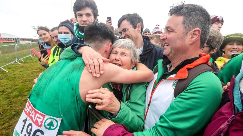 Ireland’s Darragh McElhinney celebrates with his granny Una after finishing second in the Men’s Under-23 8000m. Photograph: Bryan Keane/Inpho