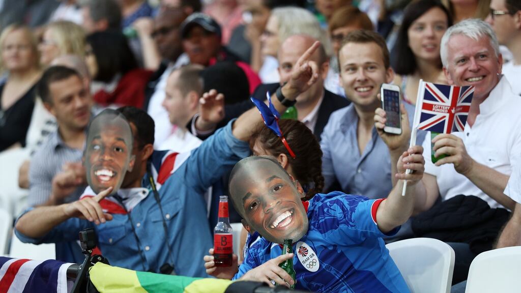 Supporters are pictured in Usain Bolt masks during day one of the 16th IAAF World Athletics Championships London 2017 at The London Stadium Photograph:  Patrick Smith/Getty Images