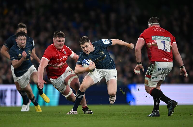 Garry Ringrose takes on Jasper Wiese and James Cronin of Leicester Tigers during the Champions Cup quarter-final at the Aviva Stadium. Photograph: Charles McQuillan/Getty Images