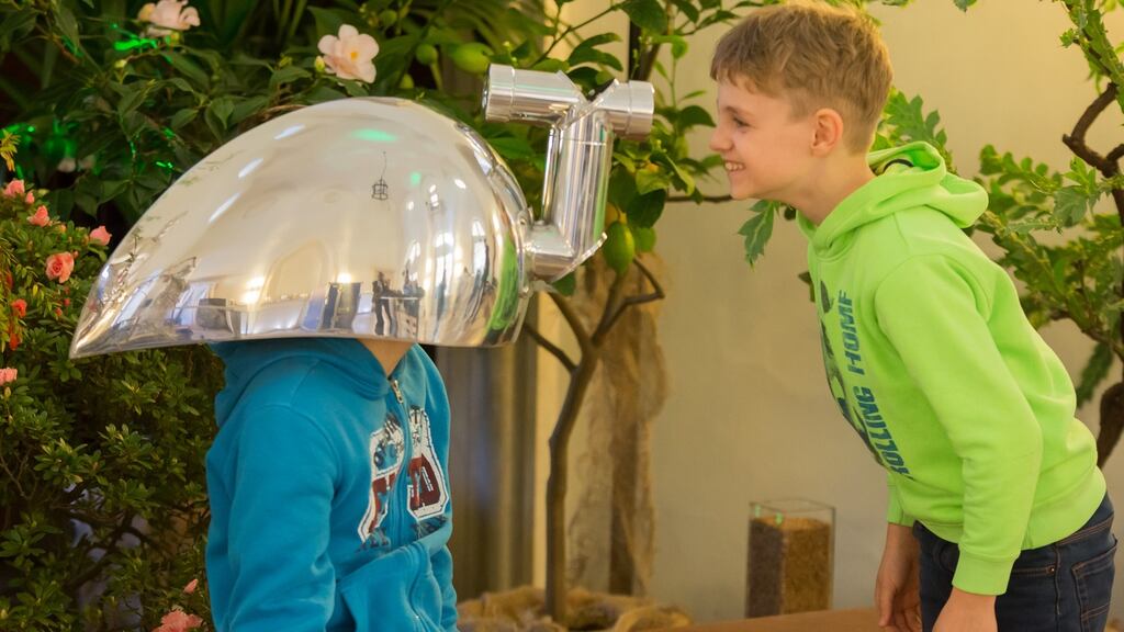 Timon (12) and Max (9) play with an animal view helmet by artists Denis Connolly and Anne Cleary at the announcement of plans for Biotopia, the natural history museum at Nymphenburg Palace, Munich. Photograph: Robert Gongoll