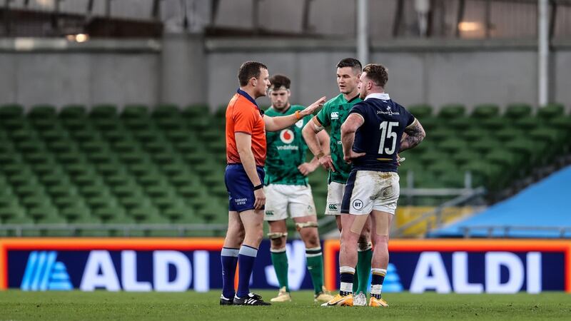 Johnny Sexton with referee Matt Carley at Aviva Stadium. Photograph: Inpho
