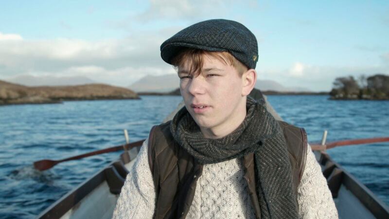 Paddy Doran wearing a tweed cap from Mucros Weaver, scarf by Aine and sweater from West End Knitwear with gilet by de Bruir. Film still: Perry Ogden/Showcase 2019
