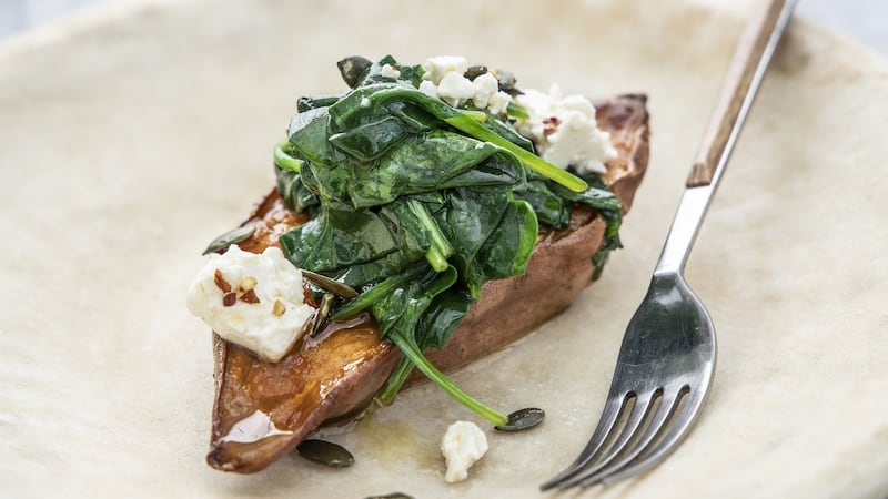 Baked sweet potato, with feta cheese and spiced pumpkin seeds. Photograph: Harry Weir Photography