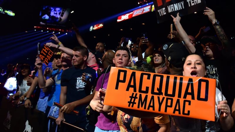 Manny Pacquiao and Floyd Mayweather fans show their support as they await the start of the pre-fight weigh-in on May 1st, 2015 in Las Vegas, Nevada. Photograph: Getty Images