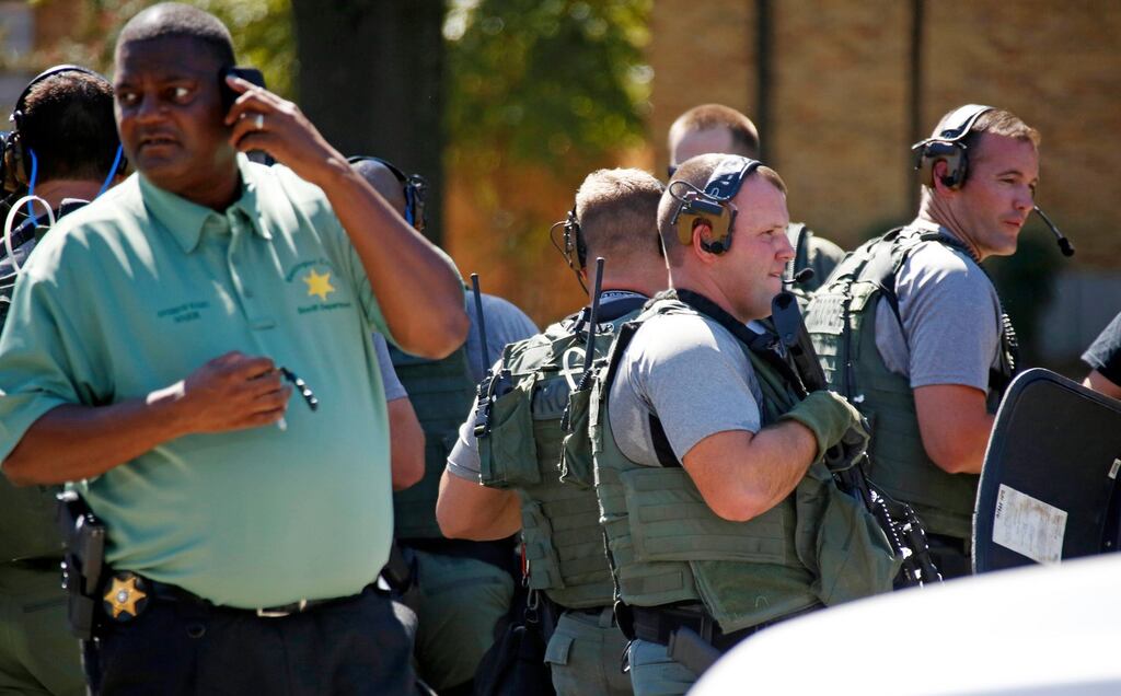 Law enforcement officers gather on the Delta State University campus where history professor Ethan Schmidt was shot in his office at Delta State University on Monday. Photograph: Rogelio V Solis/Reuters