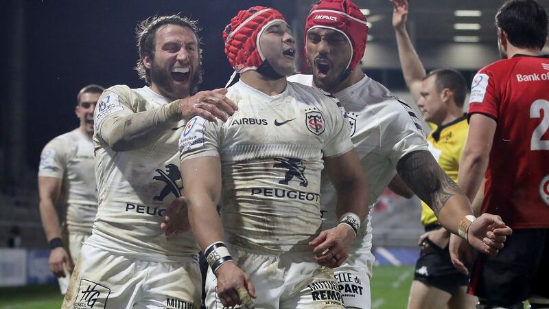 Toulouse’s South African wing Cheslin Kolbe (centre) celebrates after scoring a try during the Champions Cup match against Ulster at the Kingspan stadium in Belfast. Photograph: Paul Faith/AFP via Getty Images