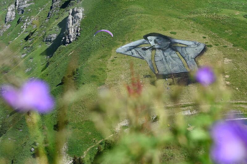Saype: one of the artist’s mountainside frescoes, of a local man, above Leysin, in Switzerland. Photograph: Alain Grosclaude/AFP/Getty