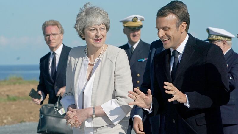British prime minister Theresa May and French president Emmanuel Macron at Ver-sur-Mer, France, during D-Day commemorations on Thursday. Photograph: Owen Humphreys/PA Wire