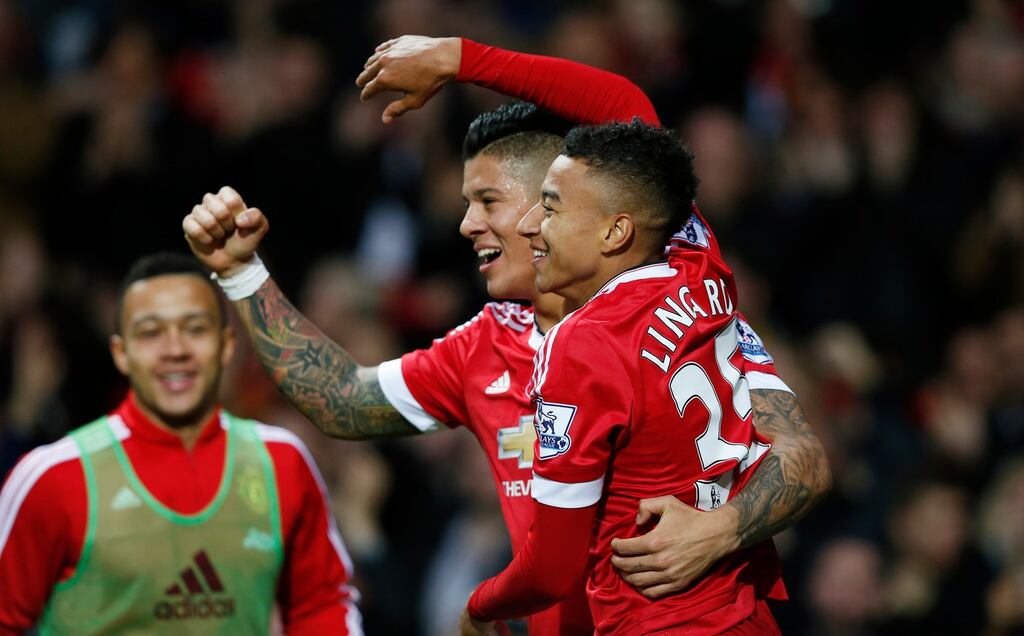Manchester United’s Jesse Lingard celebrates scoring their first goal wih Marcos Rojo. Photograph: Andrew Yates/Reuters
