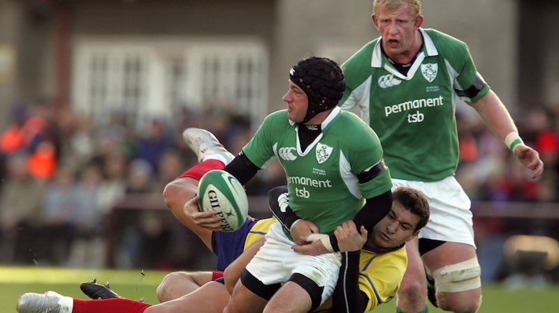 David Humphreys of Ireland is tackled by Ionut Dimofte and Petrisar Toderasc of Romania during an international match at Lansdowne Road in November 2005. Photograph: Lorraine O’Sullivan/Inpho