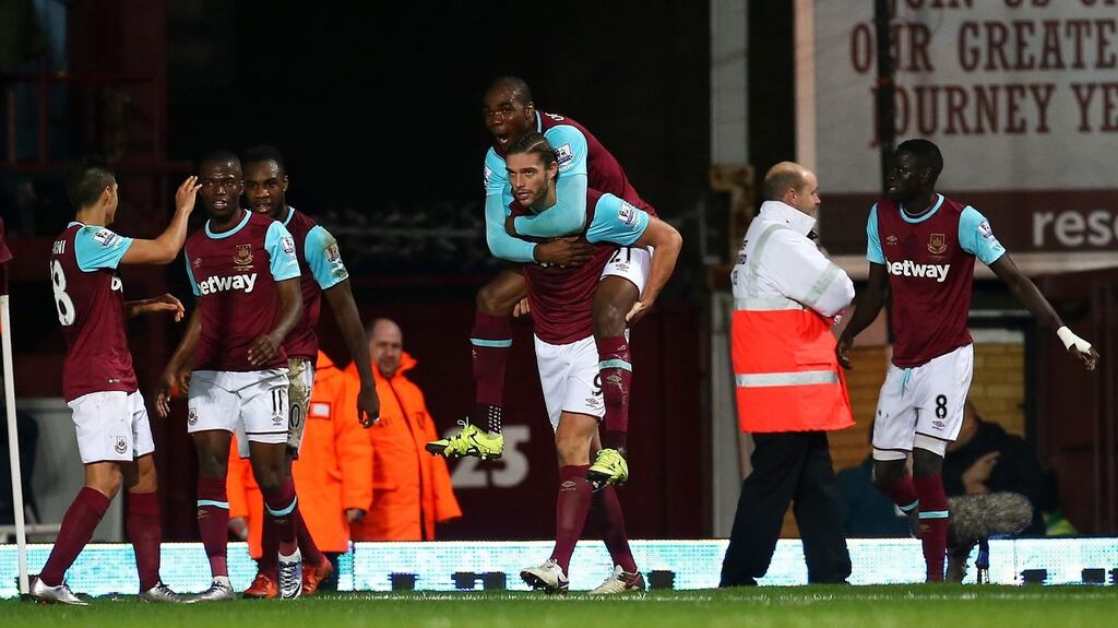 Andy Carroll of West Ham United celebrates with Angelo Ogbonna Obinza after scoring his side’s winner. Photograph: Charlie Crowhurst/Getty Images