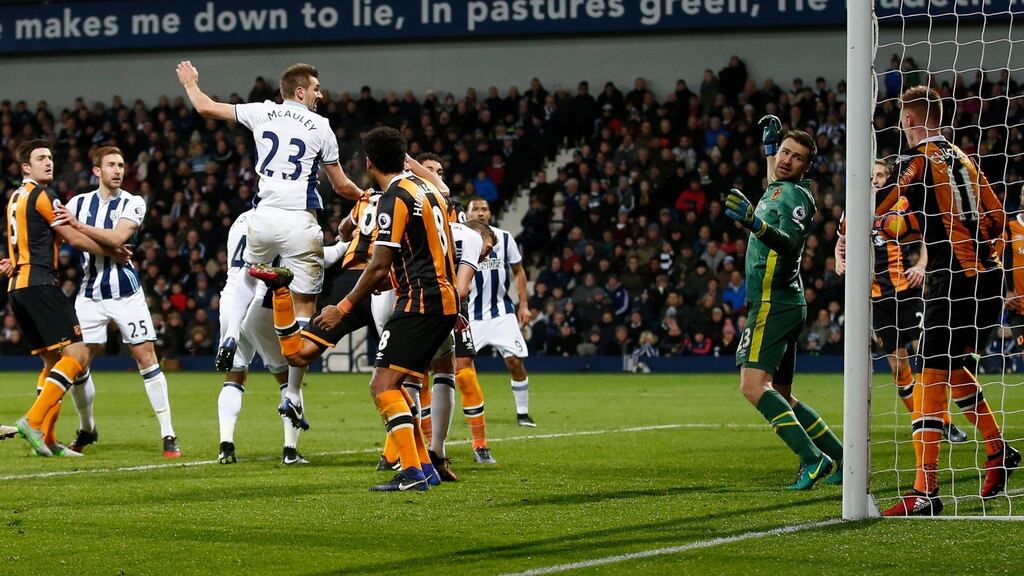 Gareth McAuley leaps to score West Brom’s second in their 3-1 win over Hull. Photograph: Reuters/Matthew Childs