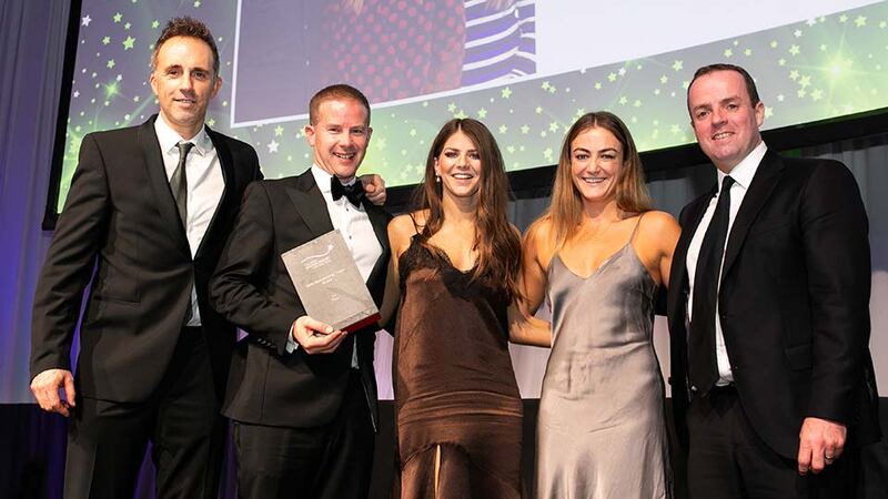 Daragh Persse, Founder, The Brand Fans, presents the Best Sponsorship Team - Brand award to the Three Ireland Team.