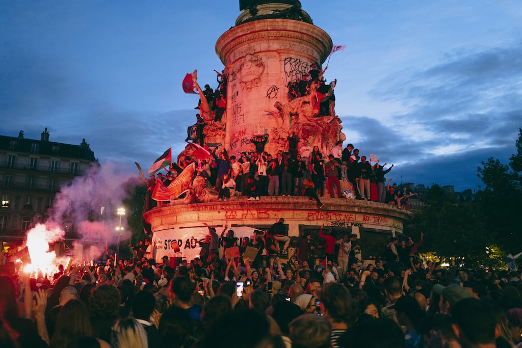 People celebrate at Place de la République following the surprise win by left-wing coalition NFP in the second round of elections on Sunday. Photograph: Lys Arango/Bloomberg