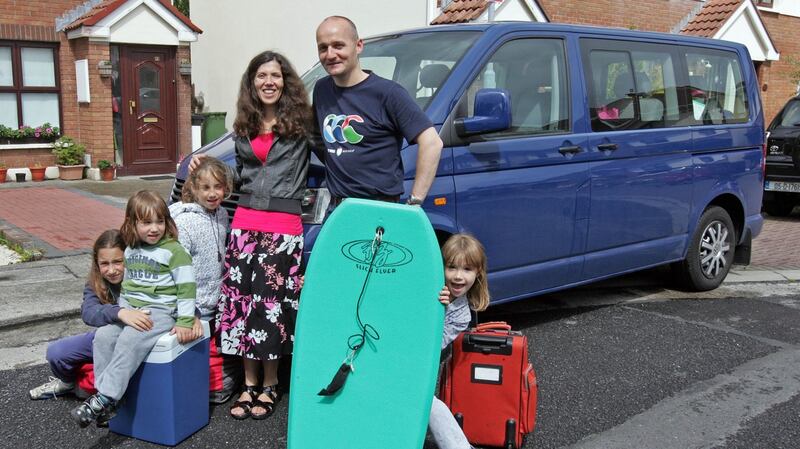 Justin Comiskey , with his wife Oriana, and children Michael (4), Lavina (6), Flavia (9) and Sandra (11) with their old VW Transporter. Photograph: Eric Luke