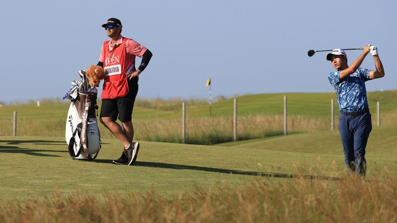 Morikawa plays his second shot on the 14th. Photo: Chris Trotman/Getty Images