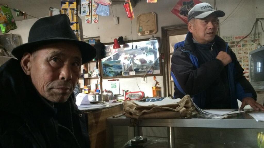 Yang Tianrong (left), a retired soldier who has been fighting local officials, attempts to evict residents from their homes in Beidaihe, China, last month. Two years into a sweeping government anti-corruption campaign, many people remain pessimistic. Photograph: Drew Jacobs/The New York Times