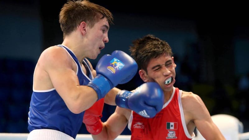 Michael Conlan catches Brian Gonzalez of Mexico during their bout in Kazakhstan this morning. Photograph: Cathal Noonan/Inpho