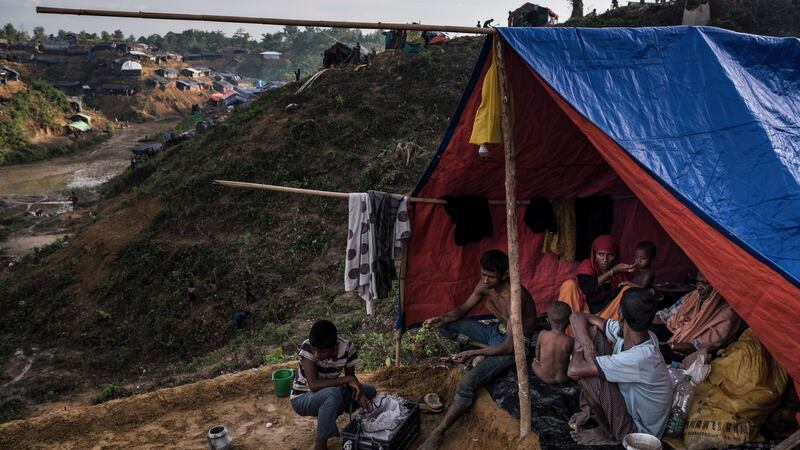 A family of Rohingya refugees sit together in their tent at the Balukhali refugee camp outside Cox’s Bazar, Bangladesh, September 24th. Photograph: Sergey Ponomarev/The New York Times