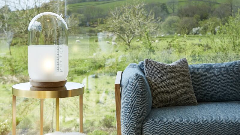 A DC sofa takes centre stage in the living room, the glass walls of which frame the Co Antrim foothills.