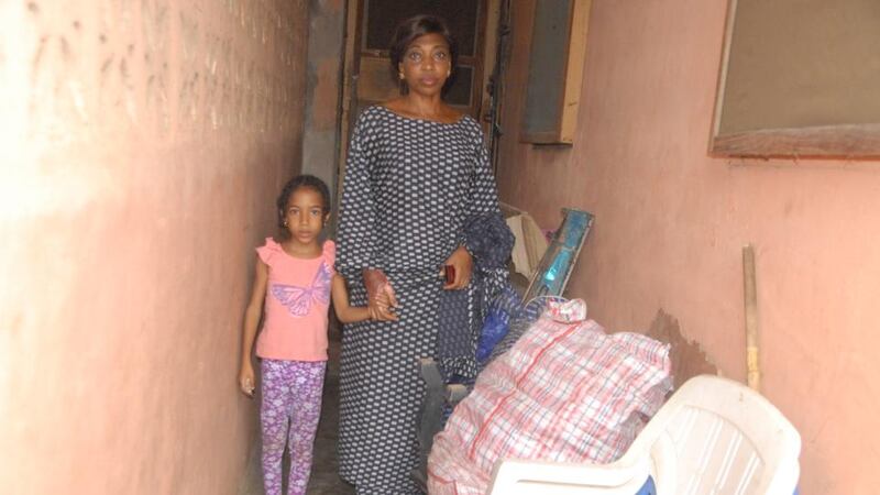 In Lagos: Claire Ojomu, who was born in Our Lady’s Hospital in Drogheda, with her mother, Funmi, outside their lodgings. Photograph: Akinola Ariyo
