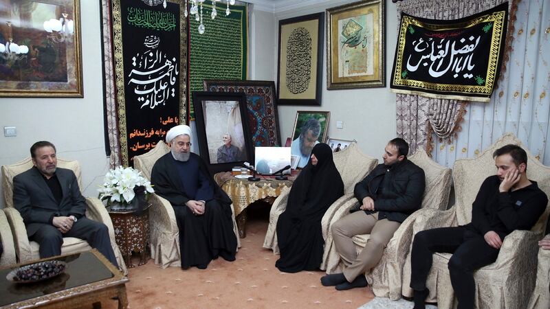Iranian president Hassan Rouhani, second left, meets the family of Qassem Suleimani. Photograph: Iranian Presidency Office via AP