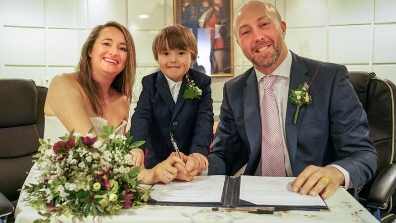 Newly-weds: Marie Ryan and Neil Ferguson, with their son Jamie (4). Photograph: Enda O’Dowd