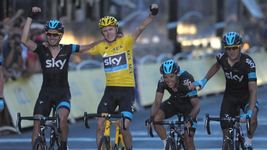 Team Sky’s Chris Froome of Great Britain (yellow) celebrates with team mates as he crosses the line to win the 2013 Tour de France in Paris. Photograph: Tim Ireland/PA Wire