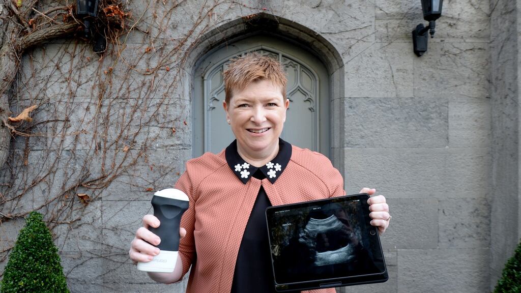 Prof Ruth Maher, inventor of a non invasive home treatment for stress urinary incontinence called Innovo, holding an ultrasound showing the impact of her device on the pelvic floor. Photograph: Alan Betson/The Irish Times