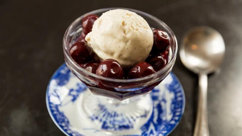 Poached cherries with vanilla and ice-cream Photograph: Emma Jarvis