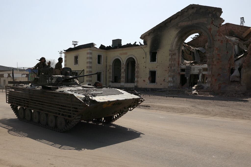 Ukrainian servicemen drive an infantry fighting vehicle (IVF) past the destroyed railway station in the town of Kostyantynivka, Donetsk region, amid the Russian invasion in Ukraine. Photograph: Getty Images