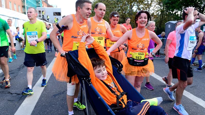 Archie Naughton from Roscommon stretches at the end of the marathon with Mark Gilleran, Frank Murphy, Tonya Hand and Sinead Gannon. Photograph: Cyril Byrne