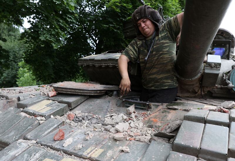 A Ukrainian serviceman exits a tank at a front line position near Kostyantynivka in the Donetsk region