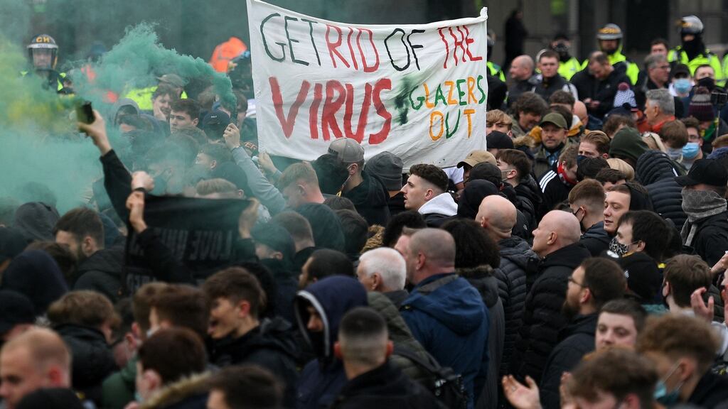 Manchester United fans protest outside Old Trafford before the match against Liverpool. Photo: Oli Scarff/AFP via Getty Images
