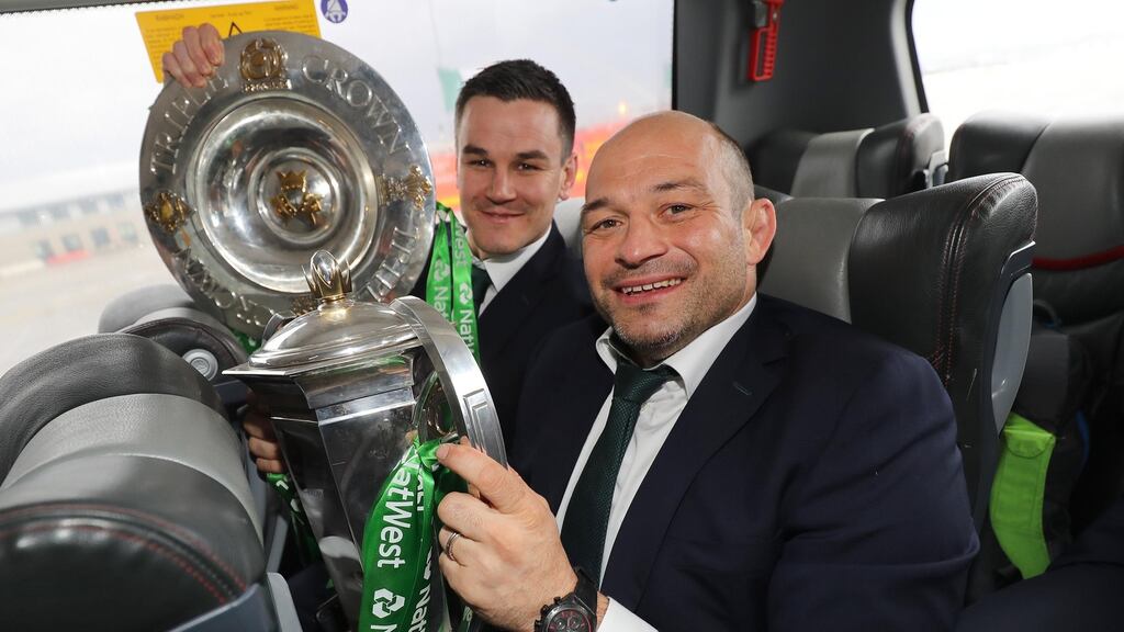 Johnny Sexton and Rory Best arrive home to Ireland with the  Six Nations trophy and the Triple Crown.  Photograph: Dan Sheridan/Inpho