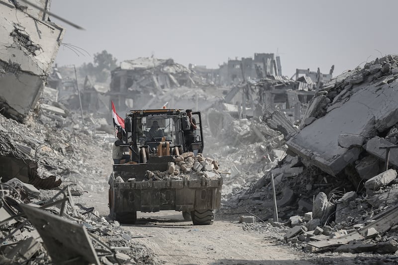 An Egyptian bulldozer moves rubble during a search for the bodies of Israeli hostages in eastern Gaza, on Sunday. Photograph: Ahmad Salem/Bloomberg