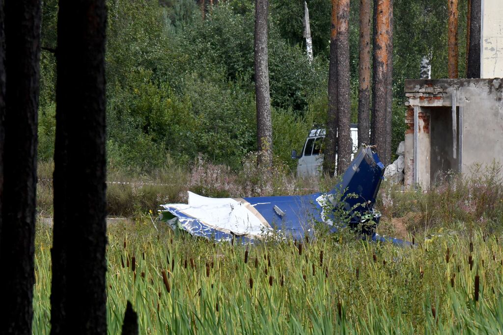 The wreckage of a plane is seen at the crash site near the village of Kuzhenkino, Tver.  Russian state-run news agencies said that Yevgeny Prigozhin, the head of the Wagner group that led a mutiny against Russia's army in June, was on the list of passenger (Photo by Olga Maltseva / AFP)