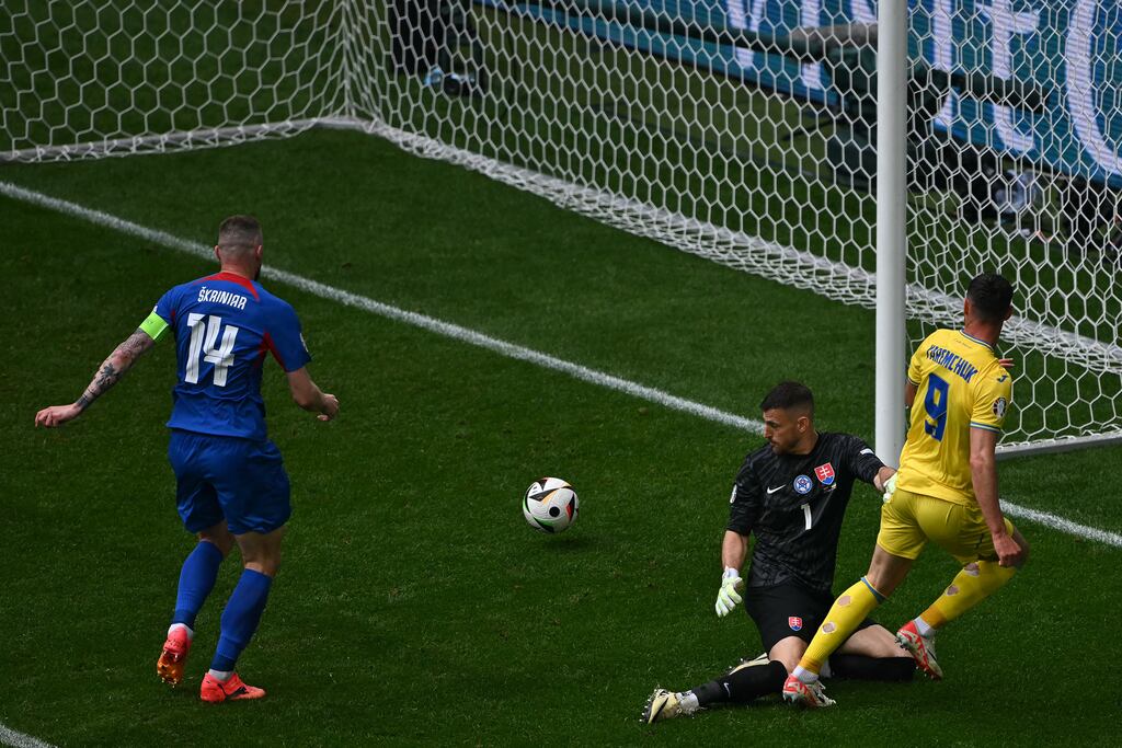 Ukraine's forward Roman Yaremchuk scores his team's second goal past Slovakia's goalkeeper Martin Dubravka. Photograph: Ozan Kose/AFP via Getty Images
