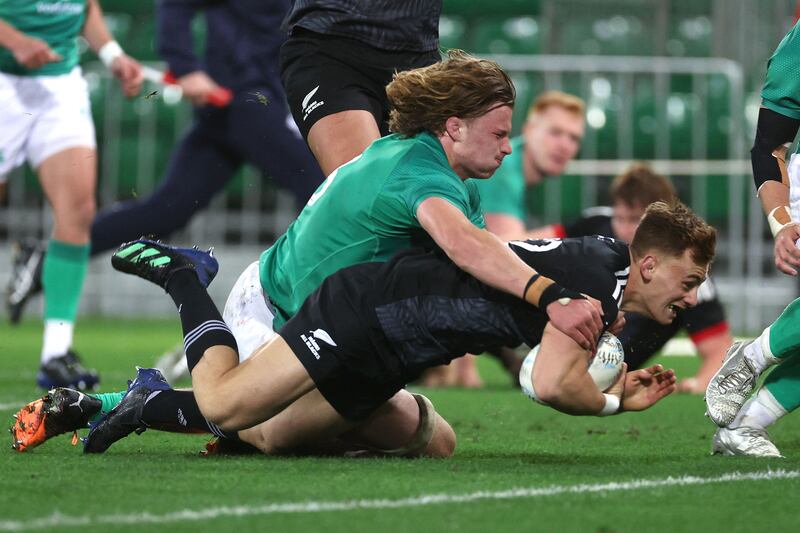 New Zealand Maori's Ruben Love scores a try as Ireland's Cian Prendergast attempts a tackle. Photograph: Marty Melville/AFP via Getty