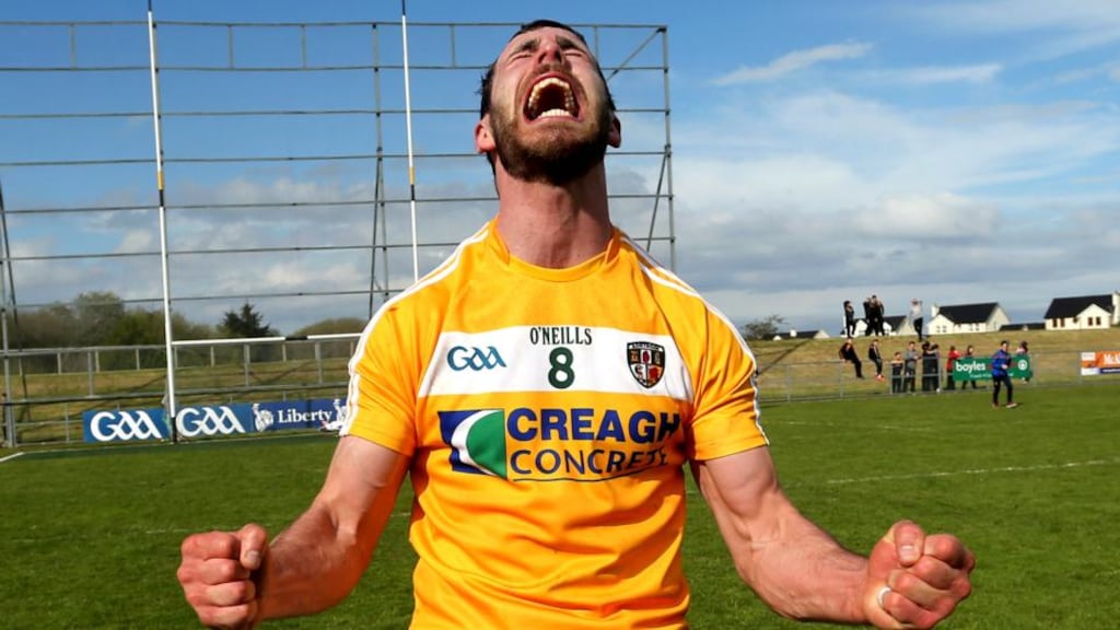Antrim’s Neill McManus celebrates a crucial victory over Laois. Photo: John McIlwaine/Inpho