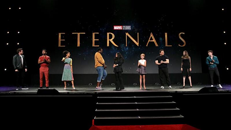 Barry Keoghan (far right) on stage with fellow The Eternals cast members (from left to tight) Richard Madden, Kumail Nanjiani, Lauren Ridloff, Salma Hayek, Lia McHugh, Don Lee and Angelina Jolie. Photograph: Jesse Grant/Getty