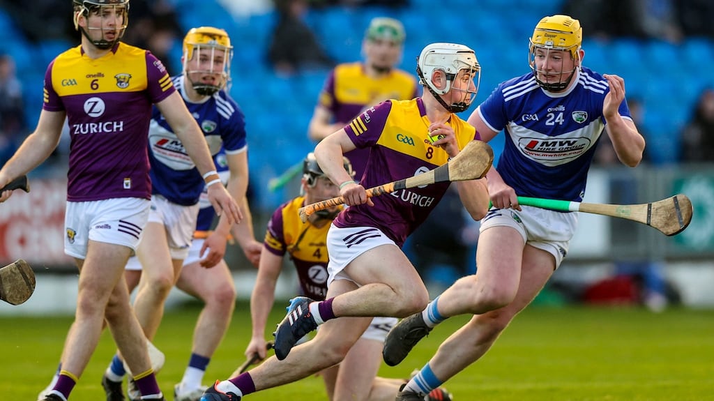 Wexford’s Darragh Carley comes up against Cathal Murphy of Laois during the O’Neill’s.com Leinster under 20 HC quarter-final at  MW Hire O’Moore Park in  Portlaoise. Photograph: Ben Brady/Inpho