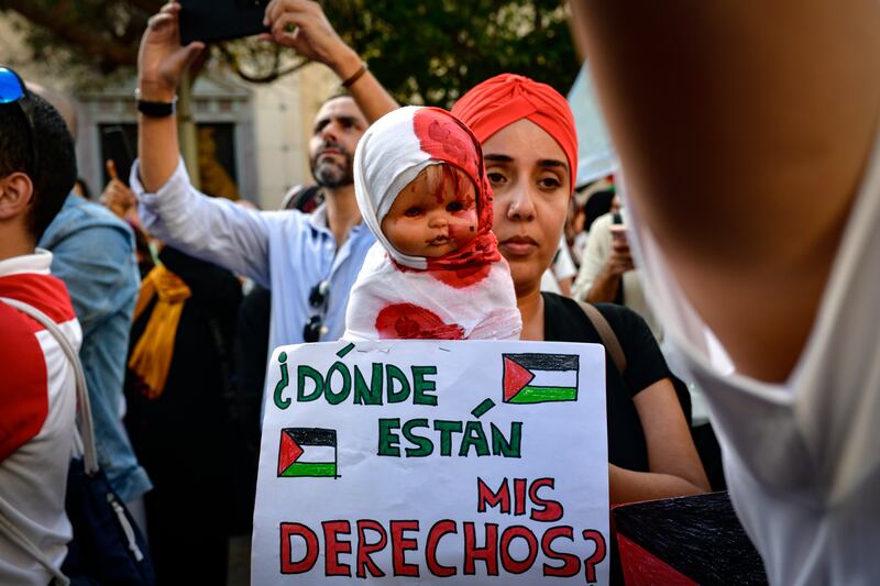 A woman appeals for the rights of children in Palestine to be respected during a demonstration in Ceuta last week. Photograph: Antonio Sempere/Europa Press via Getty Images