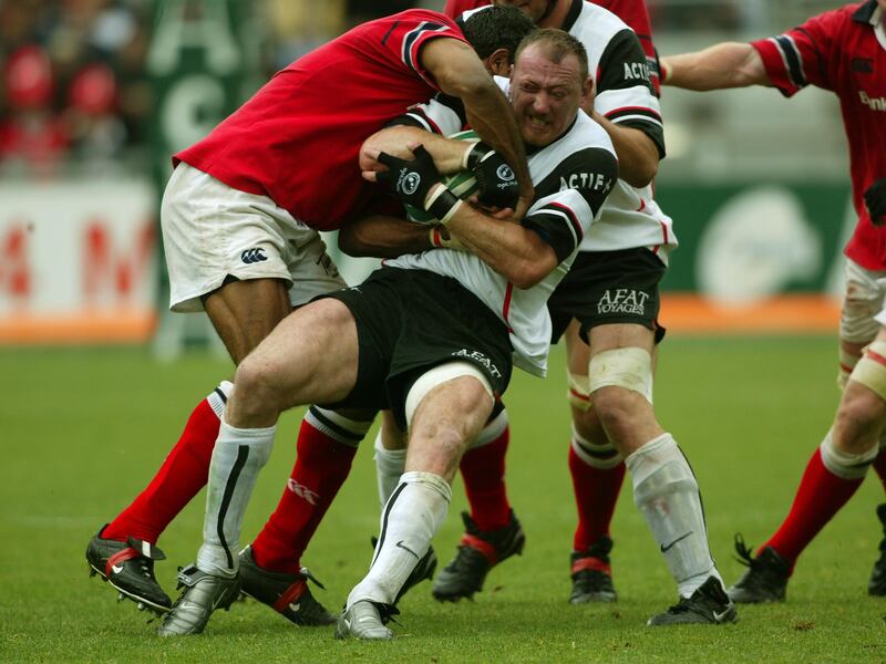 Trevor Brennan of Toulouse is tackled in the 2003 European Cup semi-final against Munster. Photograph: Billy Stickland/Inpho