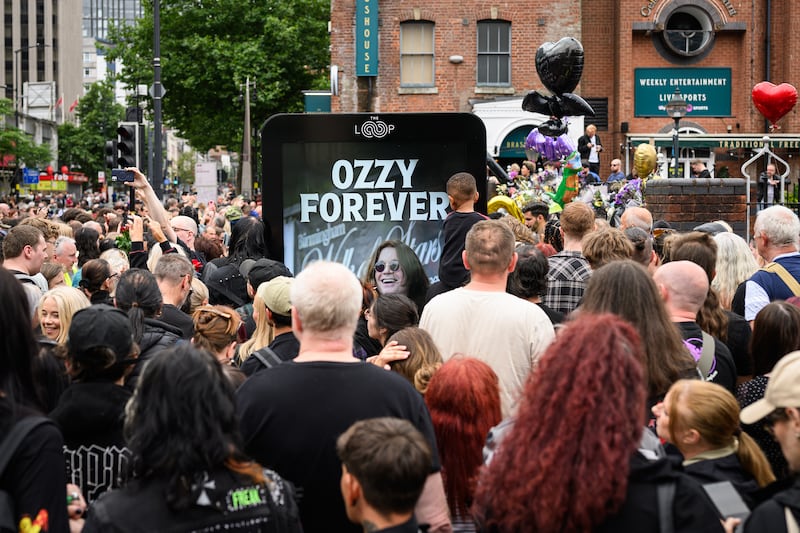 Fans gather at Black Sabbath Bridge after members. Photograph: Leon Neal/Getty Images
