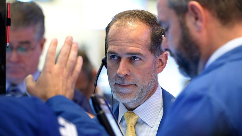 Traders work on the floor of the New York Stock Exchange as the US starts to vote.