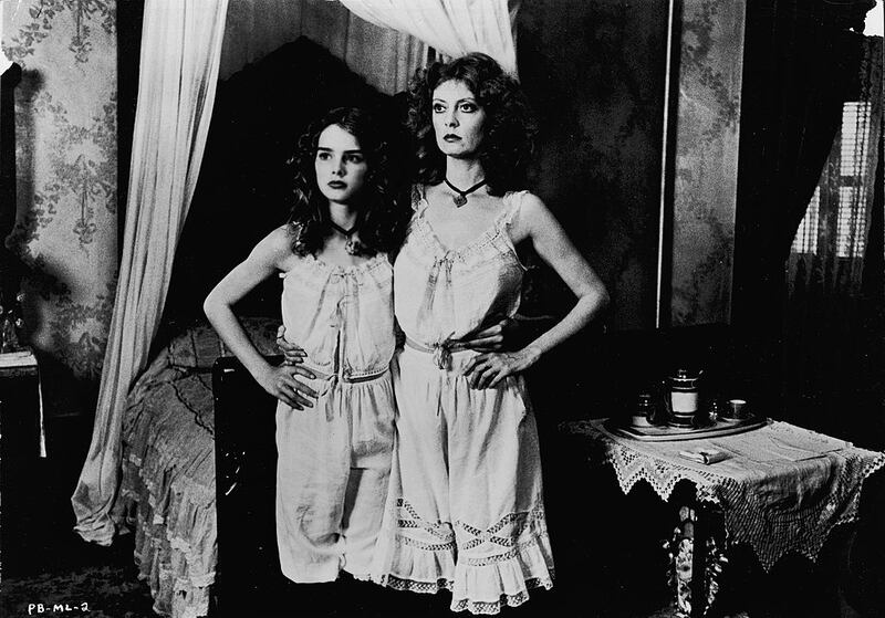 Actors Susan Sarandon (R) and Brooke Shields stand together, wearing matching slips in a still from the film, 'Pretty Baby,' directed by Louis Malle, in1975. Photograph: Paramount Pictures/Courtesy of Getty Images